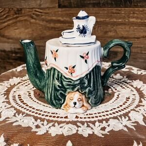 Green and white ceramic teapot